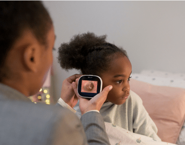 mother with tyto device on child