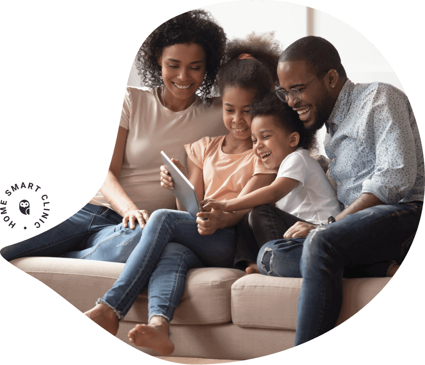 Family using tablet on sofa