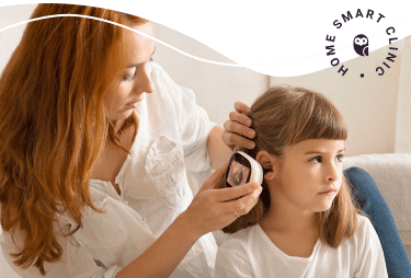 Ear exam by mother on daughter